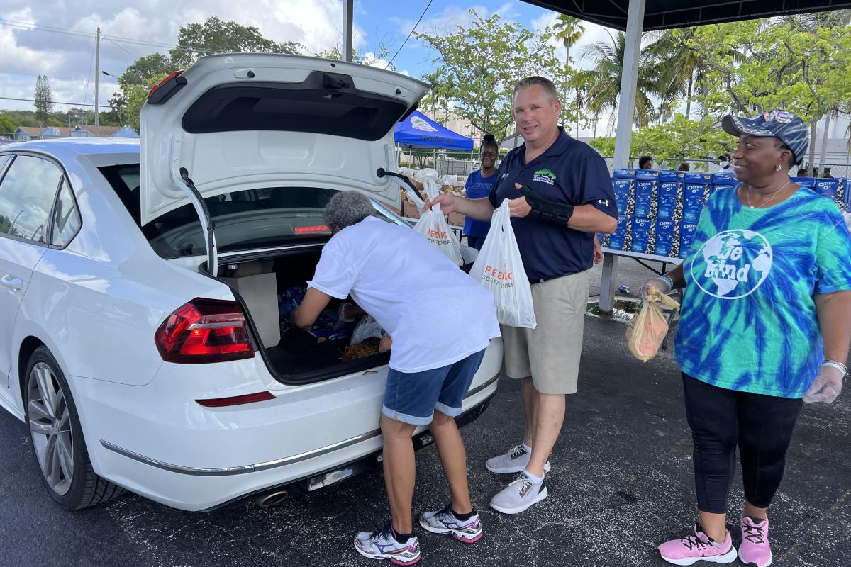 Assisting with the food drive